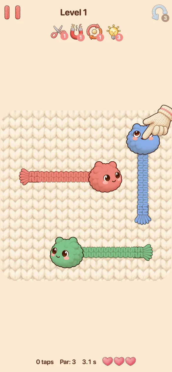 Level 1: three Tanglings, blue, red and green, on a knitted board, with a glove pointing at the one to tap first.