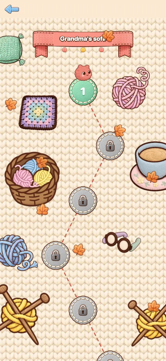 The level map of the first world, Grandma's sofa, with yarn balls, a teacup and a dotted path between levels.